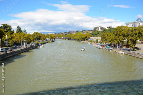 Tbilisi, Georgia - October 4, 2018: View to Mtkvari river from Bridge Of Peace photo