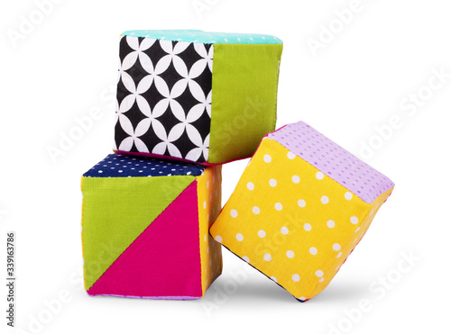 Colorful plush cube toy isolated on white