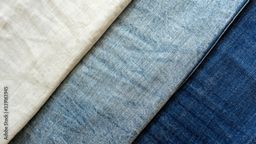 Pocket on blue jeans close-up. Textile material texture / macro denim background.