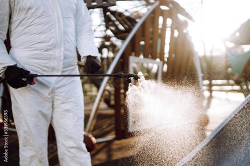 Cleaning and Disinfection the playground with spray chemicals to preventing the spread of the epidemic of coronavirus, pandemic in quarantine city. Covid-19.