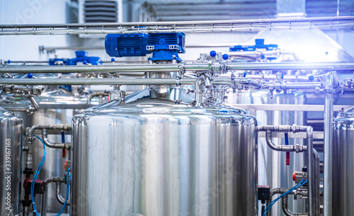 Fotografía Dairy factory with milk pasteurization tank and pipes