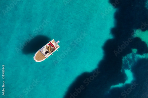 Croatia. Boat and sea as a background from top view. Turquoise water background from top view. Beach and waves. Travel - image © biletskiyevgeniy.com