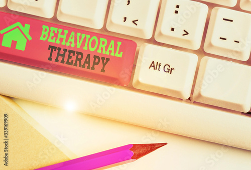 Writing note showing Behavioral Therapy. Business concept for help change potentially selfdestructive behaviors photo