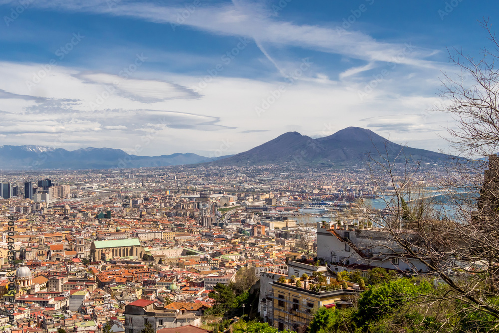 Aerial view of the city center of Naples with Mount Vesuvius on background. The bay of Naples, Italy