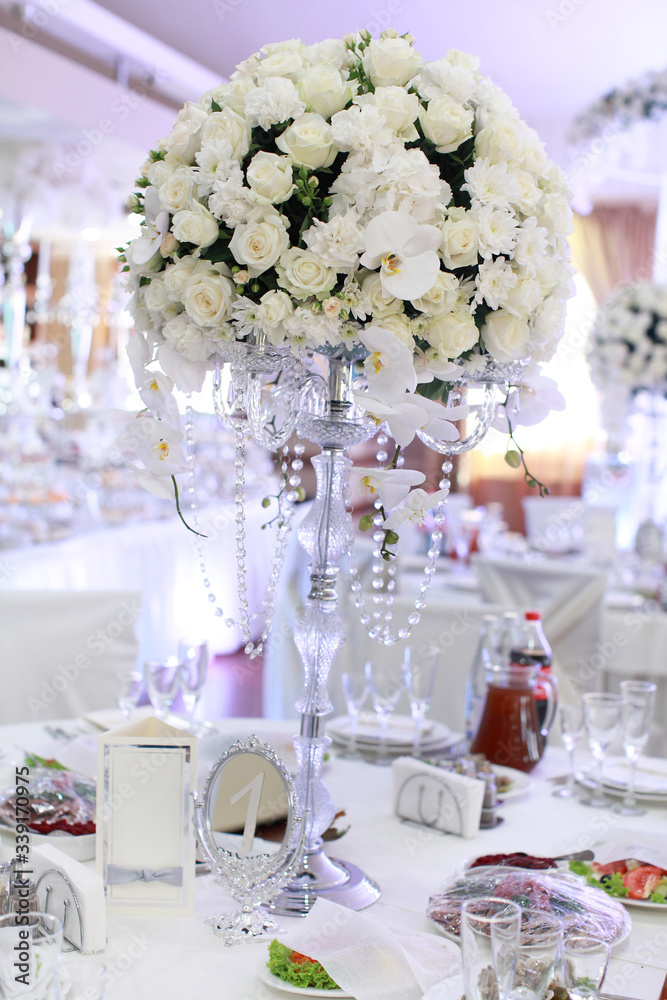 Fototapeta premium luxury wedding decorations with bench, candle and flowers composition on ceremony place
