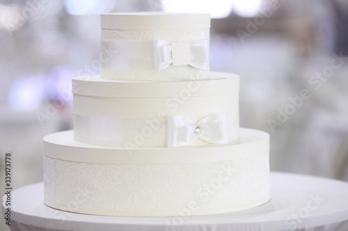 Wedding white cake on light background
