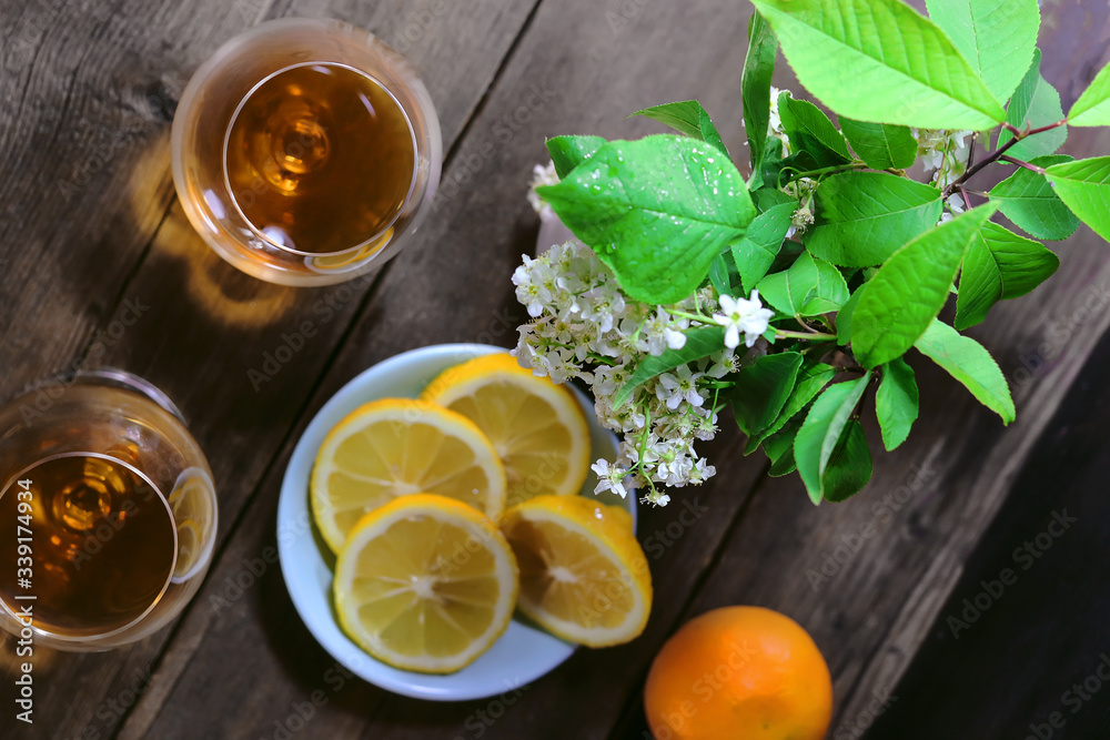 glass goblets with alcohol. Citrus fruits on a wooden table. glass goblets with alcohol. Citrus fruits on a wooden table.