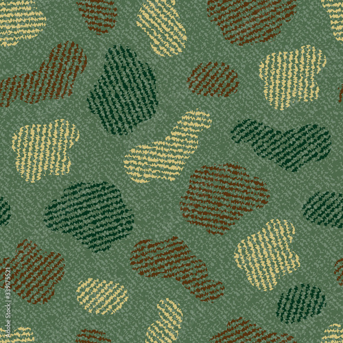 Spotted Camouflage Jeans background. Denim seamless pattern. Green jeans cloth.
