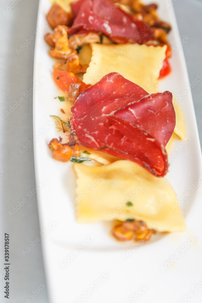 Starter, stuffed ravioli with mushrooms and ham. Starter, stuffed ravioli with mushrooms and ham.
