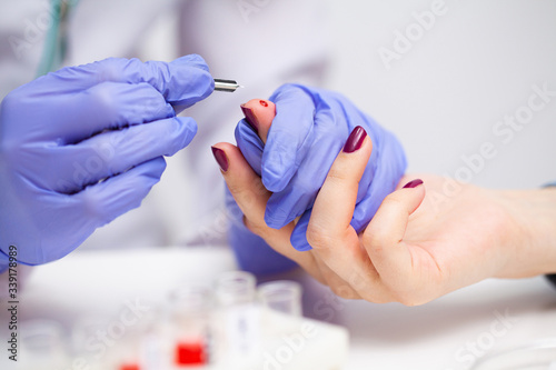 Wallpaper Mural Woman at the hospital submits a blood test for a coronavirus. Torontodigital.ca