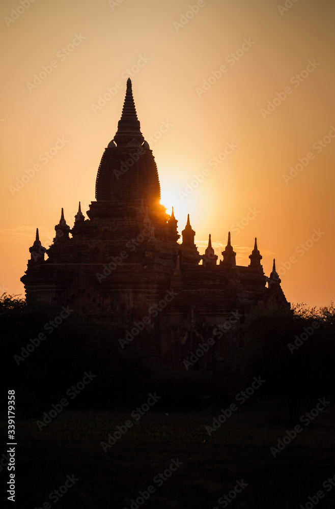 Unrecognizable temple silhouette during sunrise
