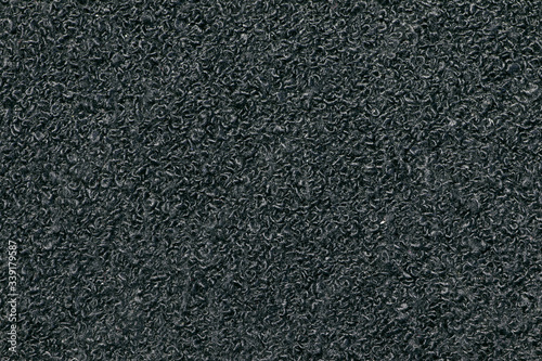 Black Synthetic fabric texture, background. Black fabric. Black background. Corrugated, groove fabric.