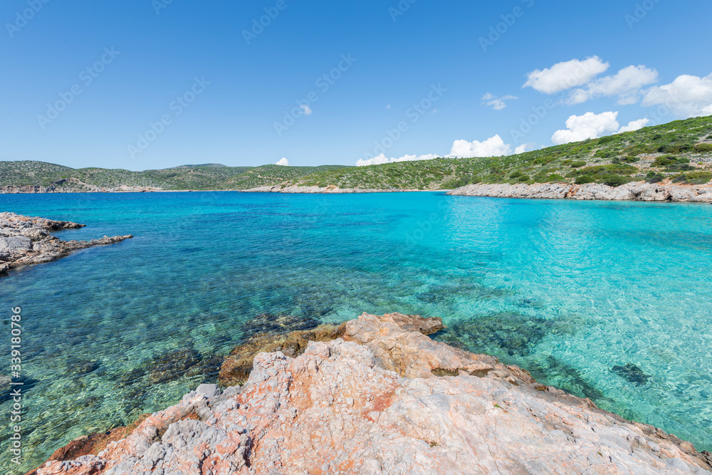 The crystal clear turquoise water at Agia Dynami beach on South Chios, Greece.