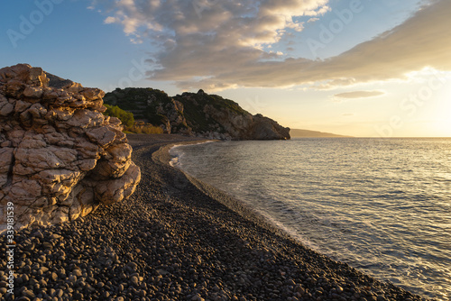 Fototapeta Naklejka Na Ścianę i Meble -  Sunrise at Mavra Volia beach on Chios in Greece.