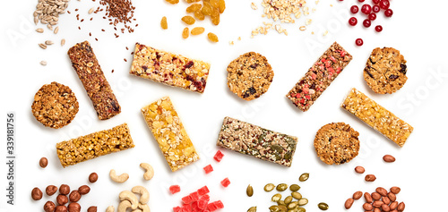 Cereal granola bar with nuts and dry fruit berries. Energy healthy snack. Protein muesli bars isolated on white background. Sport oatmeal bar, top view