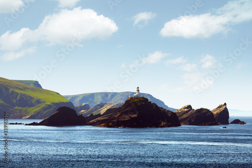 Photos Seascape with lighthouse on the isle Muckle Flugga, United Kingdom, Scotland, Shetland Islands