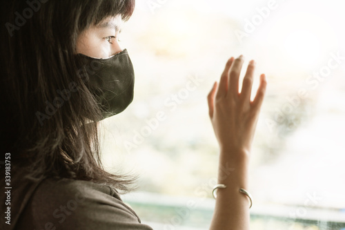 Asian woman wearing a black...
