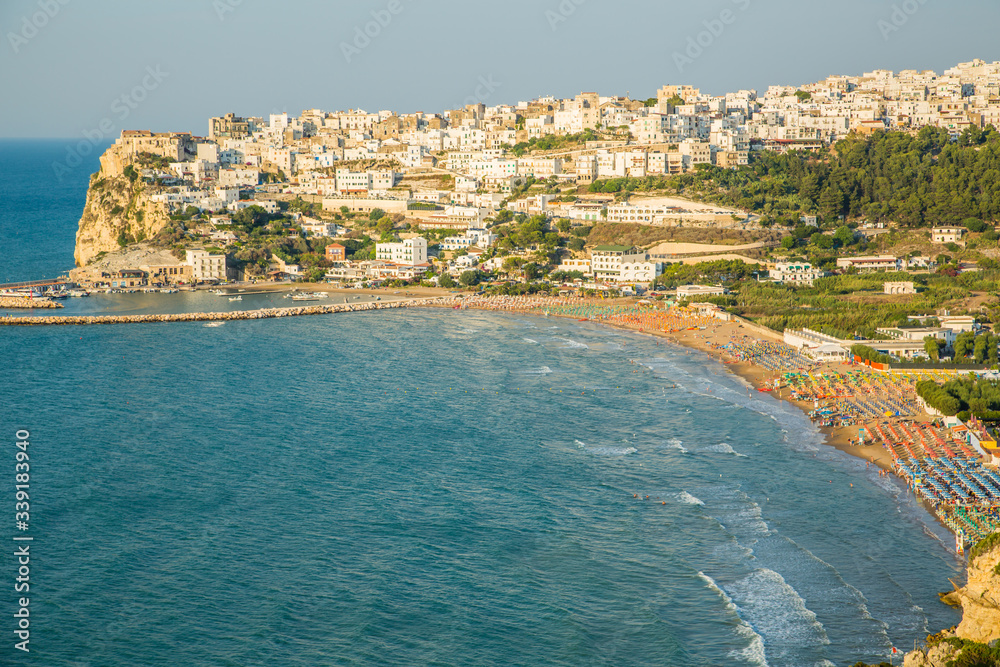 Beautiful view of the Bay of Peschici with village perched on the rock and its beach