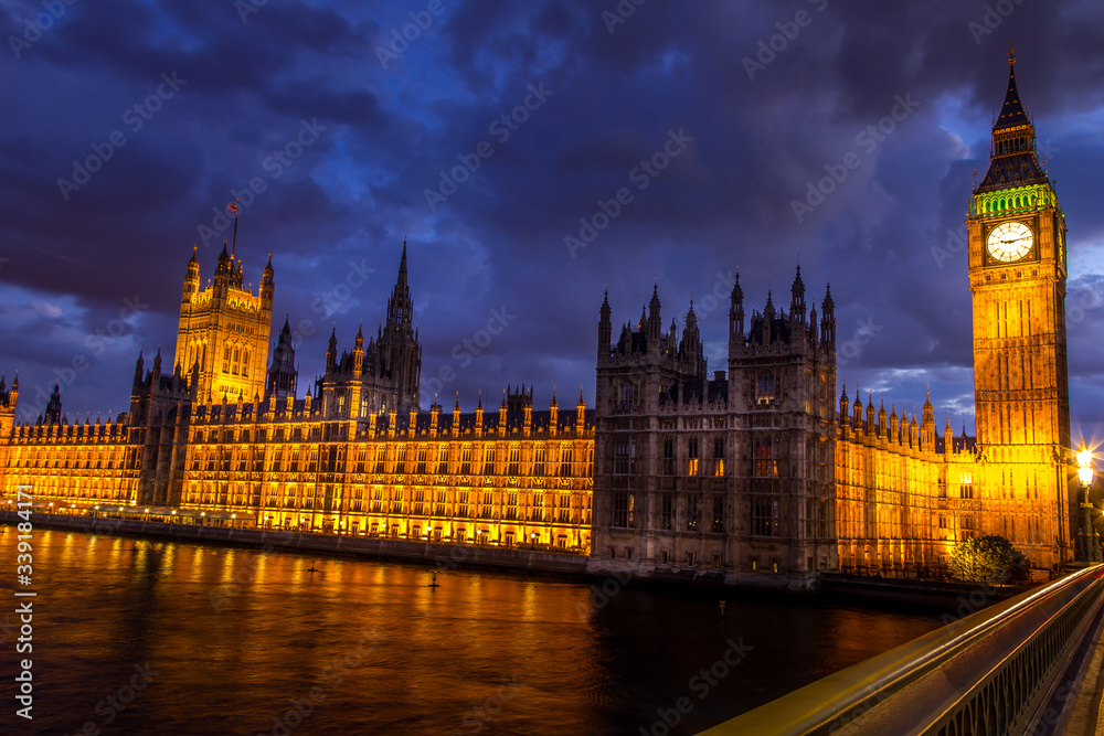 The Big Ben, the Parliament the Westminster bridge at night, London, England