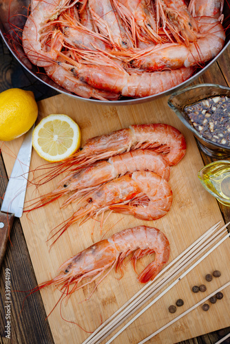 Grilled prawns. The process of cooking shrimp in soy sauce on the grill. Thai food.
