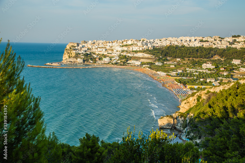 Beautiful view of the Bay of Peschici with village perched on the rock and its beach