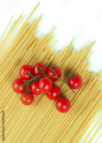  typical ingredients of Italian cuisine: spaghetti and cherry tomatoes