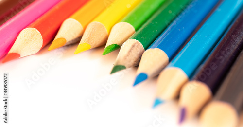 assorted colored pencils used for drawing and coloring on a white background