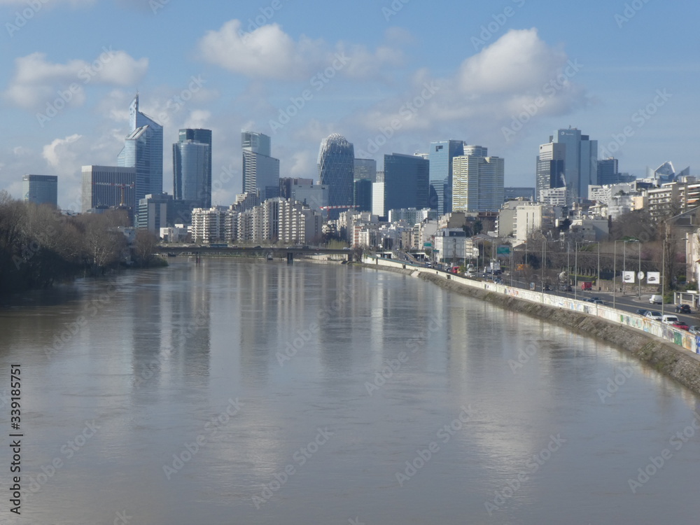 Obraz premium La Défense business district and The Seine, Pont de Levallois, France, 2020
