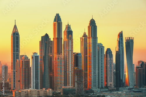 Amazing and Luxury Dubai Marina skyscrapers, famous Jumeirah beach skyscrapers at sunrise, United Arab Emirates
