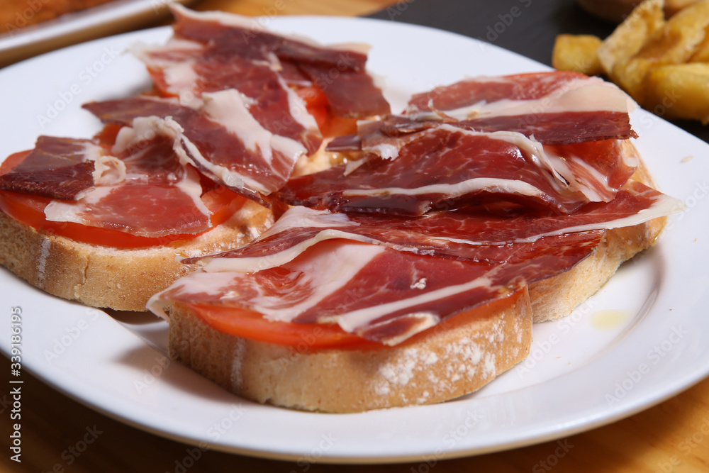Delicious bread toast with natural tomato and ham