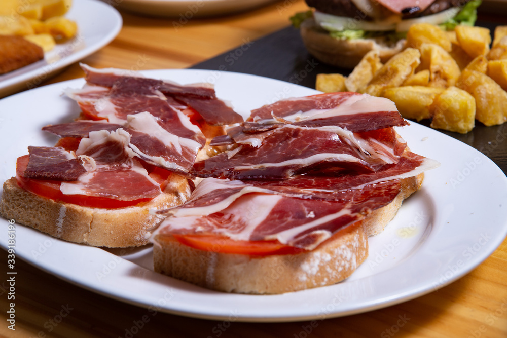 Delicious bread toast with natural tomato and ham Delicious bread toast with natural tomato and ham