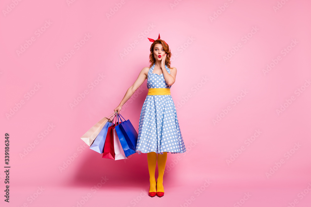 Full body photo funky cute pretty dreamy girl go shopping client center hear bargain stare stupor hold bags wear blue red footwear headband yellow pantyhose isolated pink color background Full body photo funky cute pretty dreamy girl go shopping client center hear bargain stare stupor hold bags wear blue red footwear headband yellow pantyhose isolated pink color background