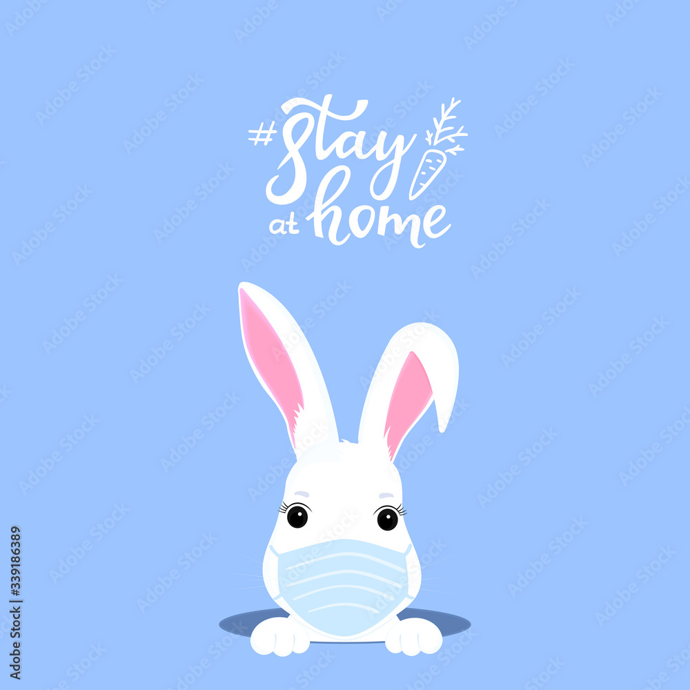 Funny Easter bunny in a medical mask peeps out of a hole. Quarantine. Self isolation. Stay home concept Funny Easter bunny in a medical mask peeps out of a hole. Quarantine. Self isolation. Stay home concept