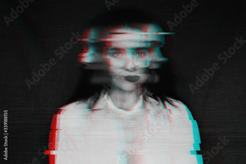 black and white blurred abstract portrait of a girl with mental disorders and schizophrenia with a glitch effect photo