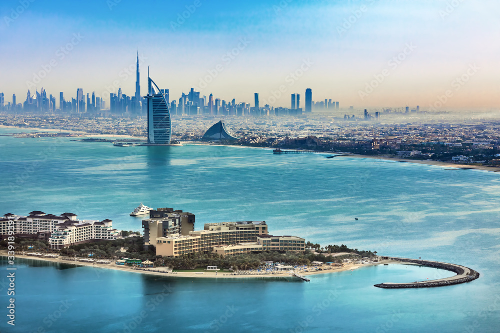 Dubai - aerial view skyline of Dubai city and famous Jumeirah beach, United Arab Emirates