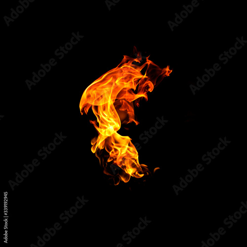Fire flames on a black background abstract. © jamroenjaiman