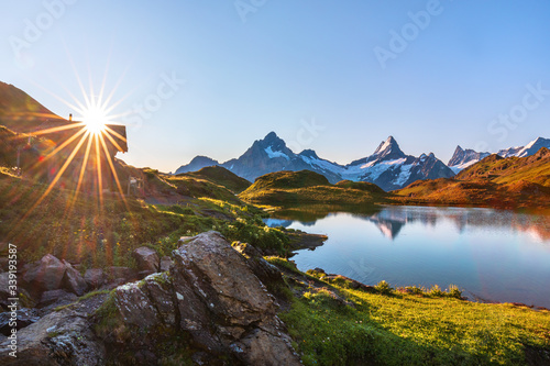 Bernese range above Bachalpsee lake. Peaks Eiger, Jungfrau, Faulhorn in famous location in Switzerland alps, Grindelwald valley