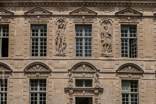 Architectural fragments of Old French house. Saint-Antoine Street, Paris, France.