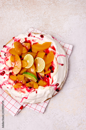 Pavlova Meringue Cake Decorated With Peach Berry Jam and Lime Tasty Homemade Dessert Top View