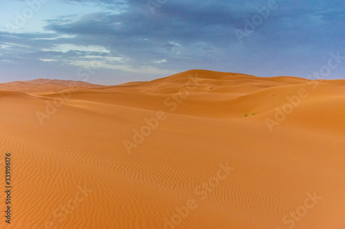 Beautiful landscape of the dunes of the Sahara Desert at dusk, Merzouga, morocco