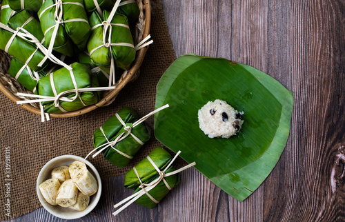 Boiled rice made from sticky rice and banana wrap banana leaf ( KhaoTomMat) photo