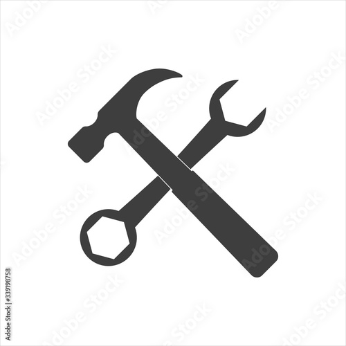 Wrench and hammer. Tools icon isolated on white background.