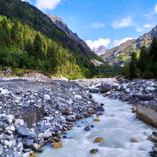 Mountain river and lots of rocks. In the far term, high mountains.
