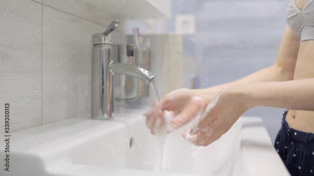 A girl washes her hands during an epidemic A girl washes her hands during an epidemic