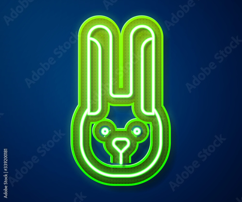 Glowing neon line Rabbit with ears icon isolated on blue background. Magic trick. Mystery entertainment concept.  Vector Illustration