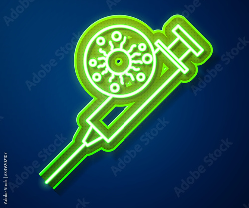 Glowing neon line Syringe and virus icon isolated on blue background. Syringe for vaccine, vaccination, injection, flu shot. Medical equipment.  Vector Illustration