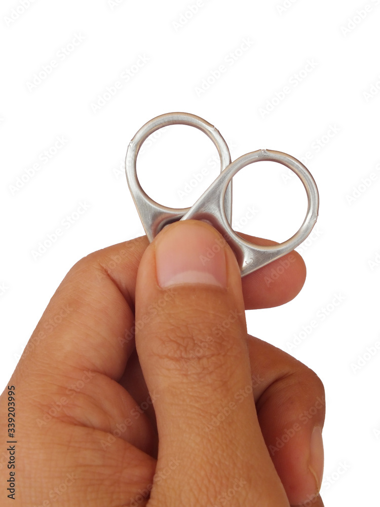 Hand holding Aluminum lids.Ring pull of cans isolated on white background. Hand holding Aluminum lids.Ring pull of cans isolated on white background.