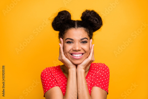 Portrait of cheerful attractive sweet afro american girl look toothy smile enjoy spring free time relax rest wear red clothes isolated over bright color background © deagreez