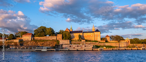 Oslo, Norway - Sunset view of medieval Akershus Fortress - Akershus Festning - historic royal residence at Oslofjorden sea shore