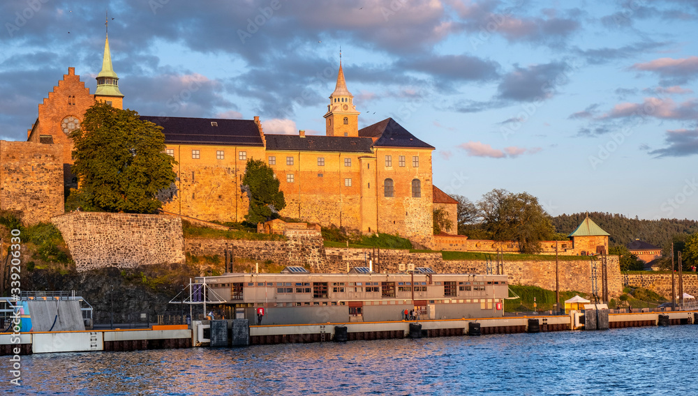 Oslo, Norway - Sunset view of medieval Akershus Fortress - Akershus Festning - historic royal residence at Oslofjorden sea shore